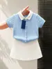 Estilo Coreano Niñas 2026 Verano Nueva Llegada Azul Claro Tejido de Punto Trenzado Cuello Polo Manga Corta Falda Blanca para Bebé Niña
