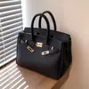 Bolso de mano transfronterizo de lujo ligero, bolso cruzado para mujer, modelo nuevo con cierre, bolso de hombro versátil, patrón de lichi, bolso de alta gama para el día a día