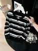 Top de punto de manga larga a rayas con cuello halter en V para Otoño/Invierno 2026 Suéter que disimula la barriga