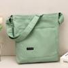 Nuevo bolso de hombro sencillo de estilo japonés para mujer, bolso informal de moda para mujer, bolso cruzado de gran capacidad, bolso de lona de color sólido, suministro