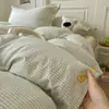 Conjunto de cama de quatro peças em algodão lavado, modelo novo 2026, estilo minimalista, listrado, com botões, jacquard tingido em fio, para uso em quarto de casa