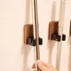 Estante para trapeador de nogal con gancho para trapeador sin perforaciones, soporte para trapeador, estante de almacenamiento fijo para montaje en pared para baño doméstico