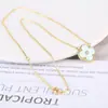 Collar con colgante de hierba de la suerte con carcasa de circonita para mujer, lujo, chapado en oro de 18 quilates, acrílico, venta caliente transfronteriza para mujer, lote
