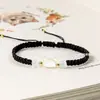 Pulsera tejida a mano de concha de gato para pareja, diseño de nicho de Ins, cuerda de mano para novia, joyería ajustable versátil