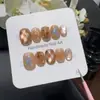 Uñas Postizas Tea KittyCaramel Milk Tea Gato Translúcido Pintado a Mano Brillo de Estrella Cortas Suaves Lindas Estilo Girly