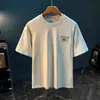 Camiseta de manga corta para hombre de algodón puro de peso pesado, nuevo modelo 2026, marca de moda estilo americano, de alta gama, elegante, cuello redondo, ropa versátil para hombre