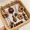 Collar de Oso Perro de Madera con Piedra Ojo de Tigre para Mujer Accesorios de Cadena de Perlas de Madera para Otoño e Invierno Diseño Lindo de Nicho