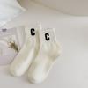 Calcetines de media pantorrilla a rayas blancas y negras para mujer, con lunares rojos, de moda para exteriores, para primavera y otoño, calcetines deportivos blancos para estudiantes.