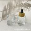Venta al por mayor del fabricante Botella de vidrio de 30 ml con fondo grueso para aceite esencial Cosméticos Sub-botella de aceite esencial Aceite de masaje Punta de pegamento Botella con gotero