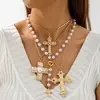 Collar cruzado personalizado europeo y americano con incrustaciones de diamantes, un conjunto de collar de alta gama con capas de gemas multicolores y perlas