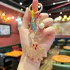 Popular llavero de murciélago de arcilla de doble cara incrustado con diamantes, pequeño colgante de Halloween para niñas, exquisito charm de bolso con cuentas de cristal