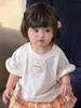 Conjunto de Verão Estilo Coreano para Bebê Menina Duas Peças, Camiseta Estilosa de Manga Curta, Saia Xadrez Colorida, Conjunto para Menina de 1 Ano