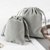 Los fabricantes recomiendan bolsa de tela para guardar el cargador puntual, bolsillo con cordón para auriculares Bluetooth, bolsa de franela gris jaspeada