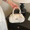 Bolso de bowling retro de nicho, bolso de mano para mujer, nueva colección otoño 2026, bolso de hombro simple, bolso cruzado, bolso Boston