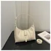 Bolso de axila para mujer de nicho, nuevo modelo de primavera 2026, lujo ligero de alta gama, versátil para el uso diario, bolso de hombro y cruzado