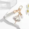 Accesorio para llavero con diamantes, moderno colgante de bailarina, llavero para teléfono de mujer con correa corta tachonada de diamantes