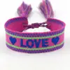Pulsera tejida bordada con corazón de amor con borla Correa tejida ajustable Accesorios para pareja de estudiantes Venta al por mayor