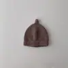 Gorro de lana cálido para bebé estilo coreano ins color liso otoño e invierno para niños y niñas simple versátil gorro para el frío