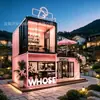 Cafetería con contenedor de doble capa estilo girly, con muros cortina de cristal panorámicos, un lugar escénico para acampar y un lugar popular para que los influencers de redes sociales tomen fotos, ofreciendo comida ligera