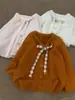 Cárdigan de punto para mujer con lazos, nuevo estilo otoño e invierno, suave y dulce, suéter adelgazante, top de abrigo para mujer