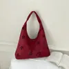 Bolso de hombro para mujer estilo coreano transfronterizo estilo universitario, bolso tote casual nuevo con diseño calado, bolso simple de gran capacidad para el día a día, para llevar debajo del brazo