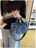 Bolsa de mano de mezclilla para mujer, gran capacidad, nuevo modelo verano 2026, simple y elegante, bolso de un solo hombro para la escuela y el trabajo