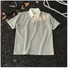 Camiseta de manga corta con cuello de camisa de dos piezas falsas para hombre, diseño nuevo de verano 2025, camiseta de media manga holgada y pesada con sentido de nicho