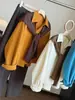 Conjunto de Dos Piezas de Camisa de Pana de Alta Gama y Chal de Punto para Mujer Otoño 2026 Nuevo Suelto Versátil Temperamento Top Tendencia