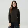 Al por mayor de fábrica, cuello alto, hombro raglán, manga larga, jersey de color liso, versátil y moderno, nuevo suéter de punto básico para otoño e invierno