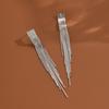 Chapado en oro real de 14K aretes de borla de diamante de moda europea y americana alta gama aretes Joker fabricantes de aretes al por mayor mujeres