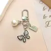 Nuevo de Moda Venta Caliente Transfronteriza Estilo Coreano Flor de Cinco Pétalos Niña Flor de Pera Colgante Llavero Accesorio Decoración para Bolsa Zouju