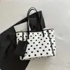 Bolsa casual coreana moderna tote do dia a dia design para ir ao trabalho popular nicho ombro único bolinhas nova grande capacidade diária 2026 versátil