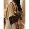 Bolso vintage para mujer, gran capacidad, nuevo otoño e invierno 2024, informal, combinable, de alta gama, bolso de trabajo de un solo hombro para mujer.