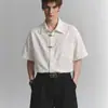 Nova coleção de verão e outono de 2026: Tops e camisas da moda estilo chinês para adolescentes, apresentando designs únicos tanto para homens quanto para mulheres.