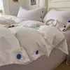 Juego de cuatro piezas estilo minimalista de algodón 100% Clase A con botones, sábana de cama lavada a rayas de hilo teñido puro de algodón, funda de edredón individual, juego de tres piezas para dormitorio 4