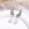 Pendientes de plata S925 con forma de aguja, estilo europeo y americano, con alas sencillas y perlas incrustadas en diamantes, pendientes femeninos de alta calidad y nicho de temperamento moderno.