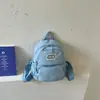 La nueva mochila de lunares estilo ins universitario coreano de Ruien es una mochila linda y de nicho para estudiantes de secundaria y preparatoria.