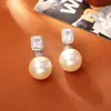 Suministro Directo de Fábrica Pendientes de Perla de Vidrio Shijia Moda de Gama Alta Exquisitos Pendientes de Zirconia Cubo de Azúcar Joyería Estilo Socialité