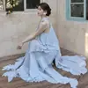 Look de Início de Verão 2026: Vestido Longo Estilo Resort Francês com Babados, Barra Irregular, Elegante Vestido de Gola Halter