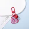 Llavero de campana con forma de corazón de resina con purpurina de colores con anillo de aleación, decoración de llavero colgante con purpurina degradada, regalo