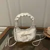 Bolsa de Nube de Nicho Estilo Coreano Nuevo Modelo 2026 Bolso de Mano Plegado de Alto Valor para Viaje Casual Cruzado