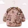 Babero de terciopelo de cristal para bebé, impermeable, antidesgaste, con bolsillo de arroz, para otoño e invierno, delantal para madre y bebé.