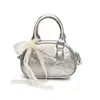 Bolso de Bowling de Moda de Nicho de Alta Apariencia para Mujer 2026 Nuevo Elegante Bolso de Hombro Cruzado con Relieve de Gama Alta