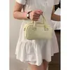 Moda de Primavera Bolso de Mano para Mujer Bolso Tote Pequeño Modelo Nuevo 2026 Color Sólido Bolso Cuadrado Pequeño Simple Bolso Versátil de Hombro Cruzado