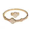Conjunto de Pulsera y Anillo Flor de la Suerte Flor de Concha Planta, Cobre Electrochapado, Estilo Fresco y Dulce