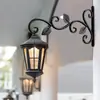 Cesta colgante de hierro forjado estilo europeo transfronterizo, soporte para flores de pared, estante colgante para flores, soporte para macetas, carillón de viento, soporte para farola
