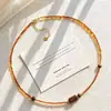 Cadena para la clavícula estilo Melard de granate sintético para otoño e invierno con un diseño único