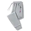 Calças de moletom de lã de cordeiro forradas de lã espessadas quentes calças casuais roupas externas calças esportivas de algodão inverno masculino novo outono e inverno