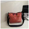 Nuevo diseño de nicho transfronterizo estilo japonés ins casual simple moda bolsa de hombro para teléfono de nailon bolsa cruzada a cuadros