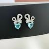 Exquisitos aretes de botón con forma de corazón y moño con microincrustaciones de pequeños diamantes de imitación brillantes Azules de diamantes completos Aretes simples de rábano de fácil combinación